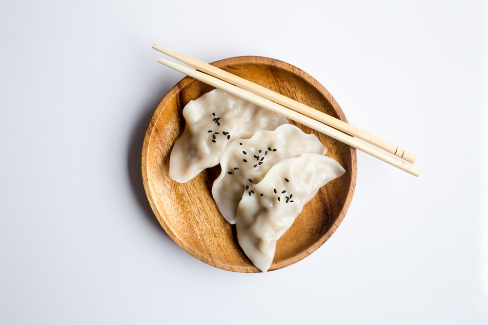 Stacked bamboo steamers with handmade dumplings